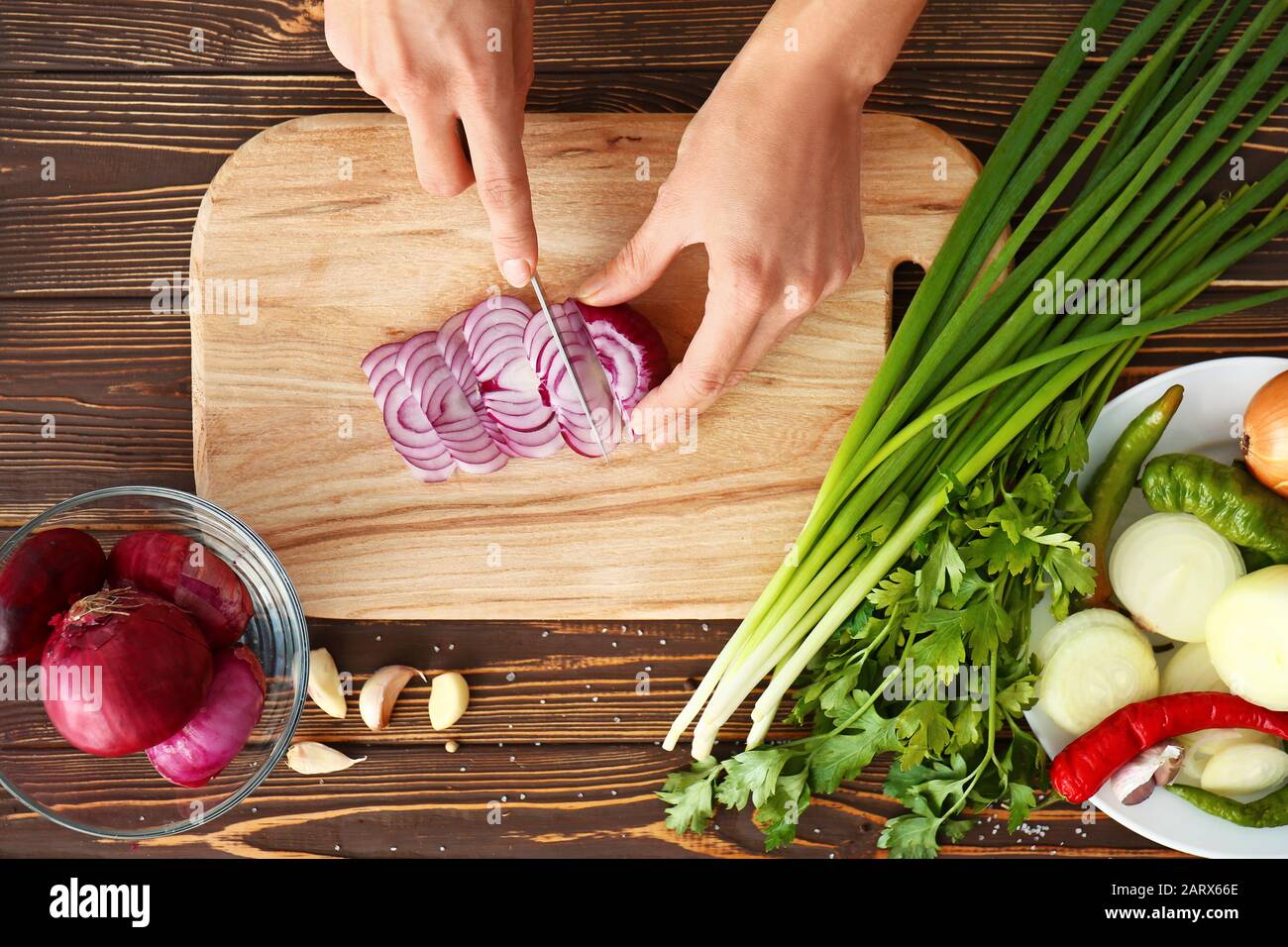 Woman cutting onion in hi-res stock photography and images - Alamy