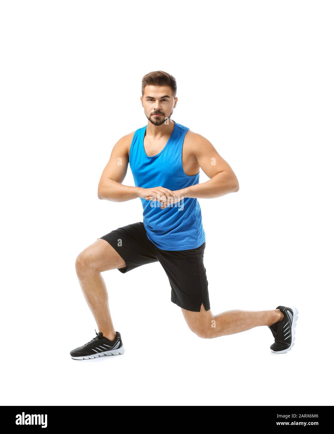 Sporty young man training against white background Stock Photo - Alamy