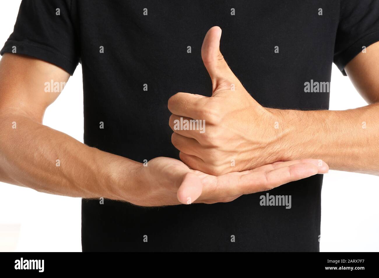 Young deaf mute man using sign language, closeup Stock Photo