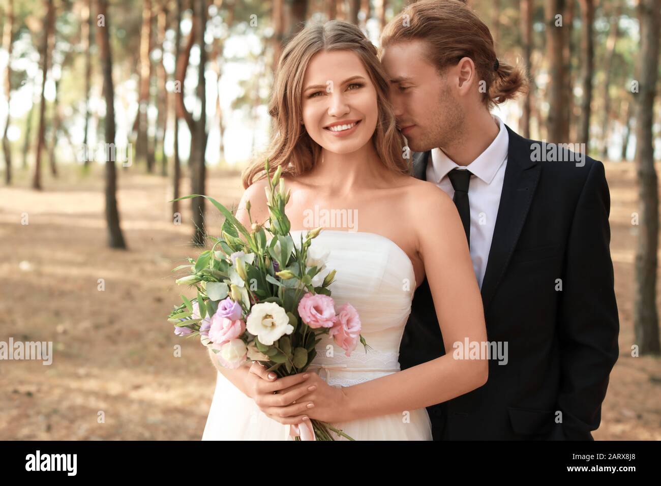 Happy couple celebrating their wedding outdoors Stock Photo - Alamy