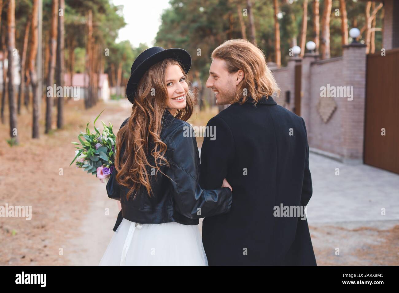 Happy couple celebrating their wedding outdoors Stock Photo - Alamy