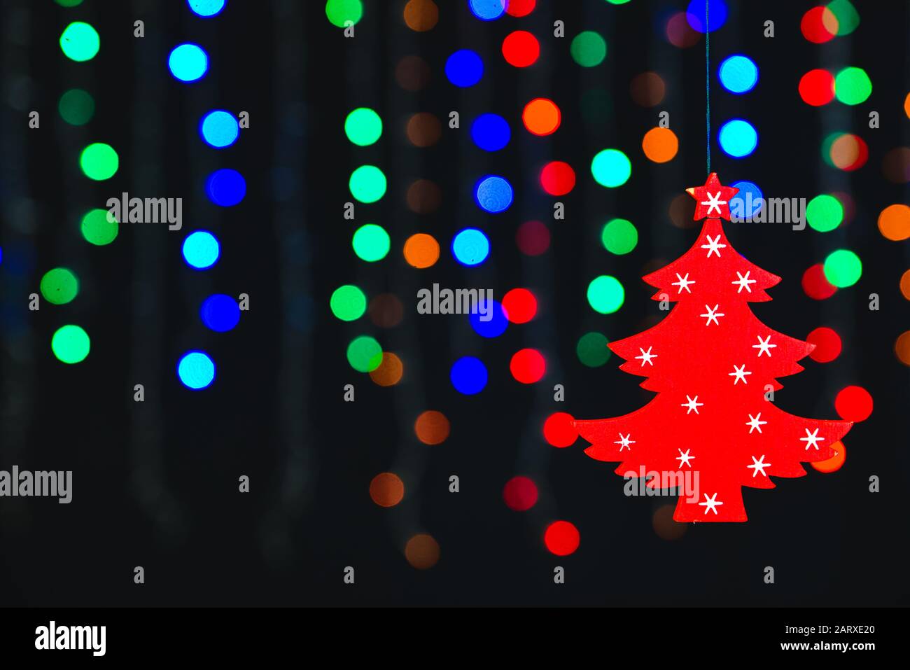 Christmas tree on dark background with glowing lights Stock Photo - Alamy