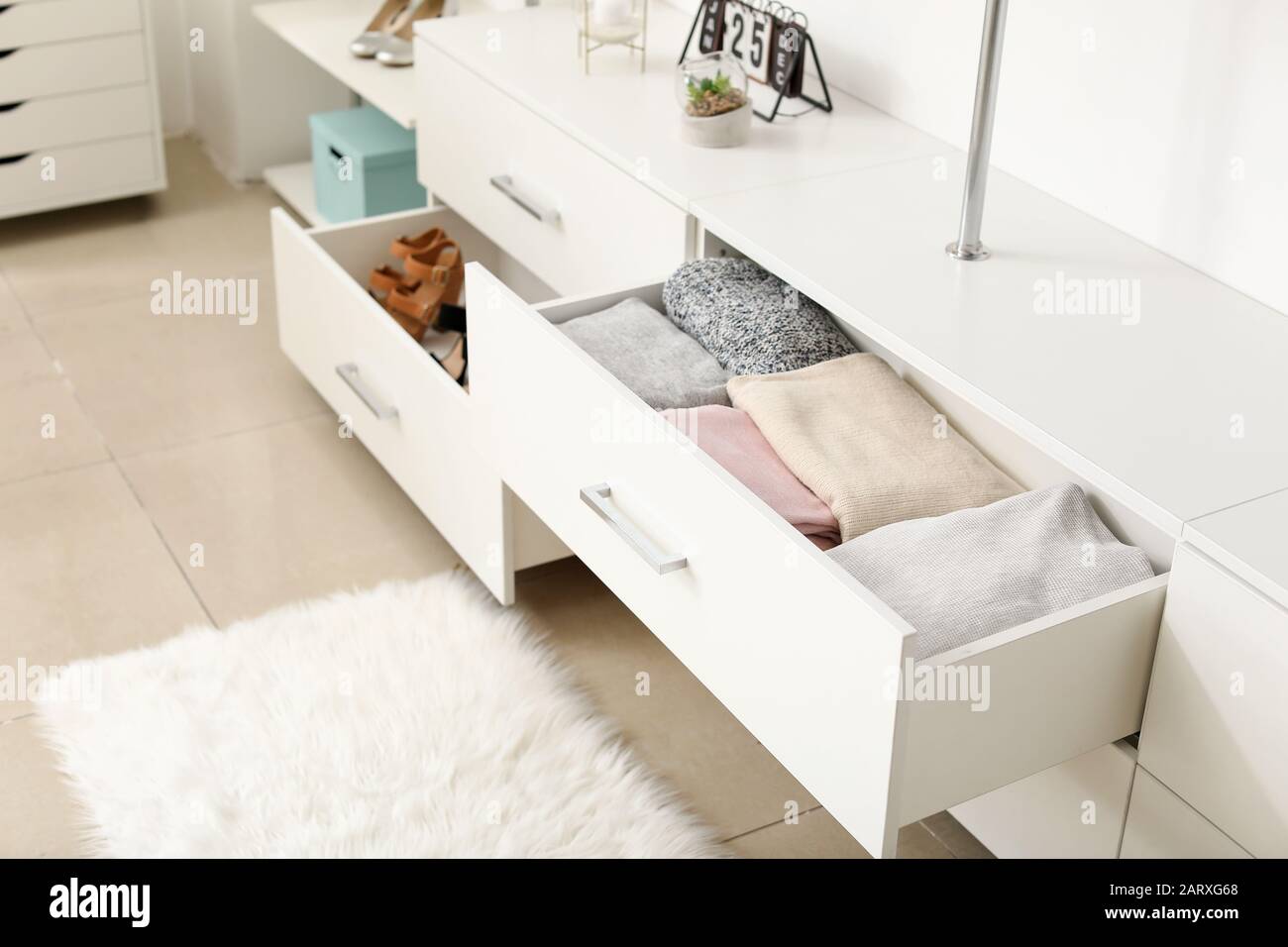 Drawers with clean clothes in dressing room Stock Photo Alamy