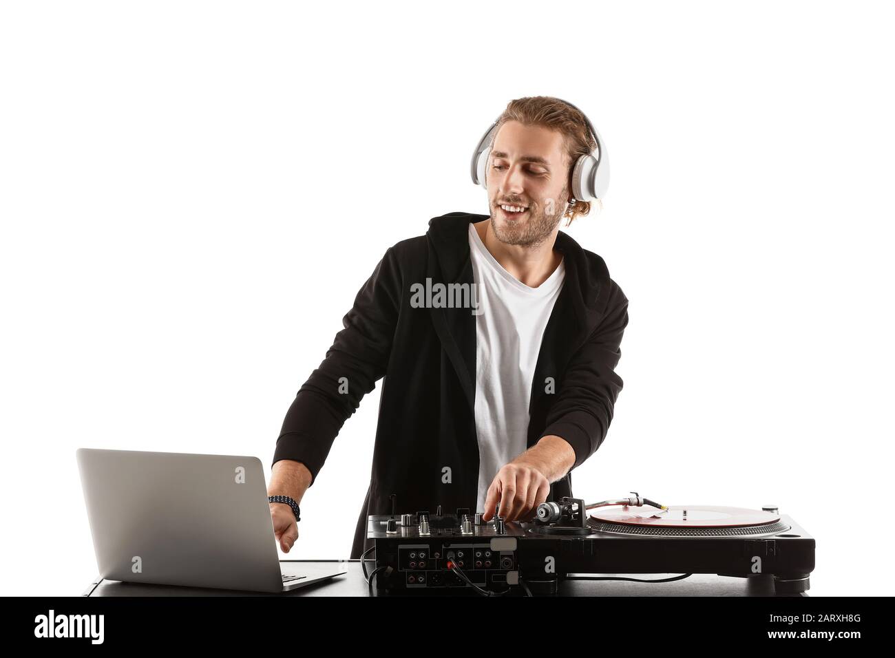 Male dj playing music on white background Stock Photo - Alamy