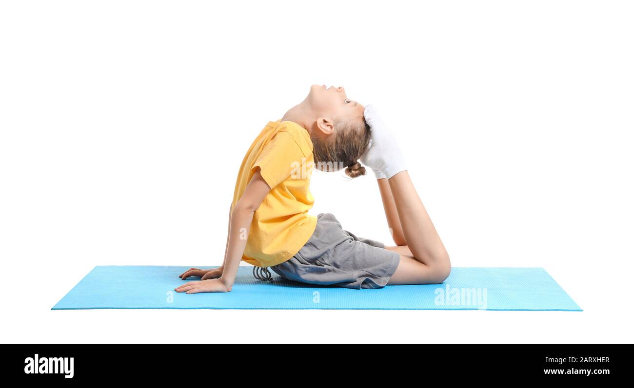 Little girl practicing yoga on white background Stock Photo - Alamy