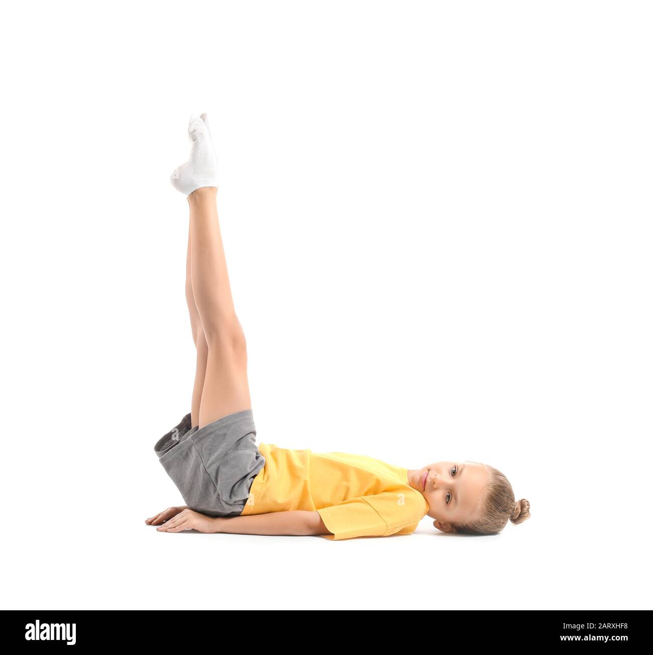Little girl practicing yoga on white background Stock Photo - Alamy