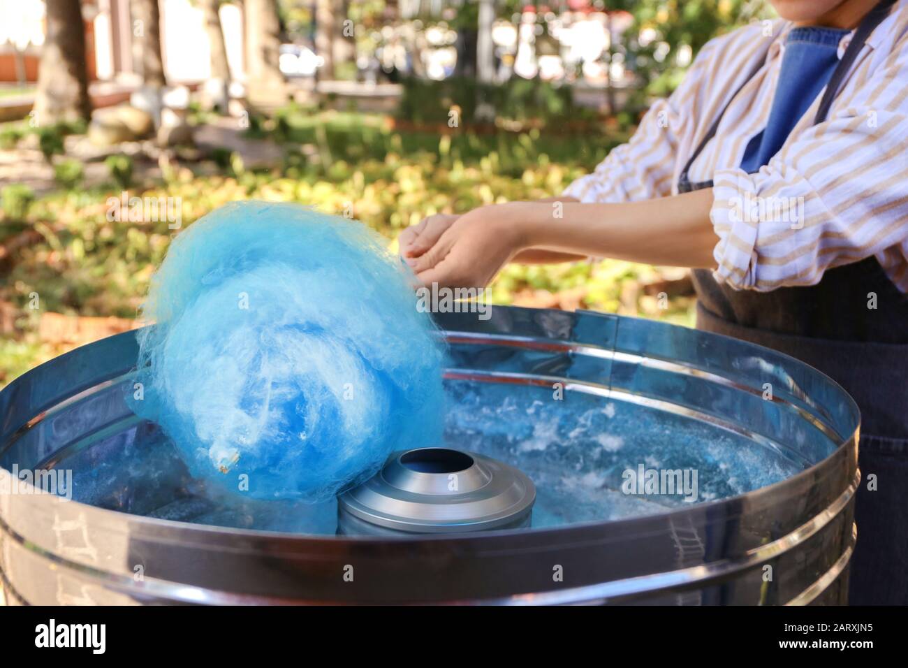 Making of sweet cotton candy outdoors Stock Photo - Alamy