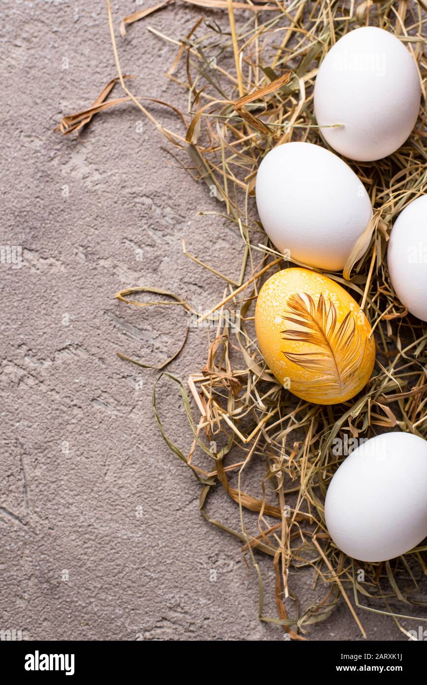 Easter painted chicken golden egg Stock Photo