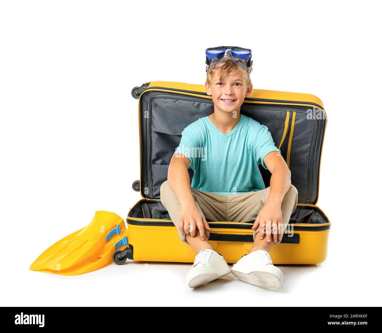 Cute little boy sitting in suitcase on white background Stock Photo Alamy
