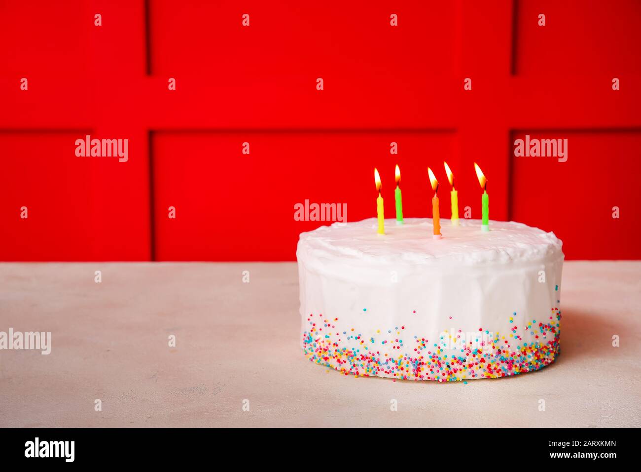 Tasty Birthday cake on table against color background Stock Photo - Alamy