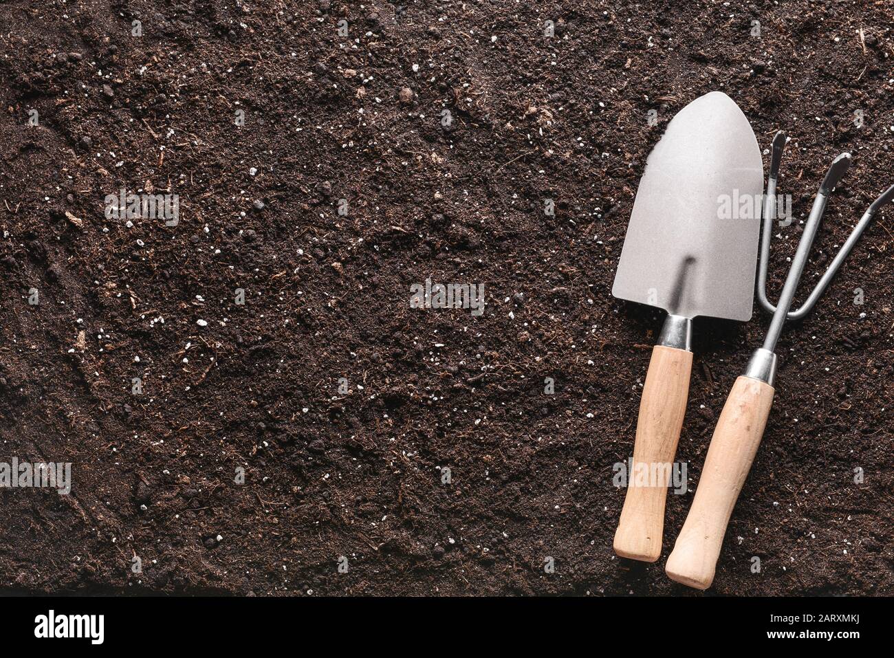 Gardening tools on soil, top view Stock Photo - Alamy
