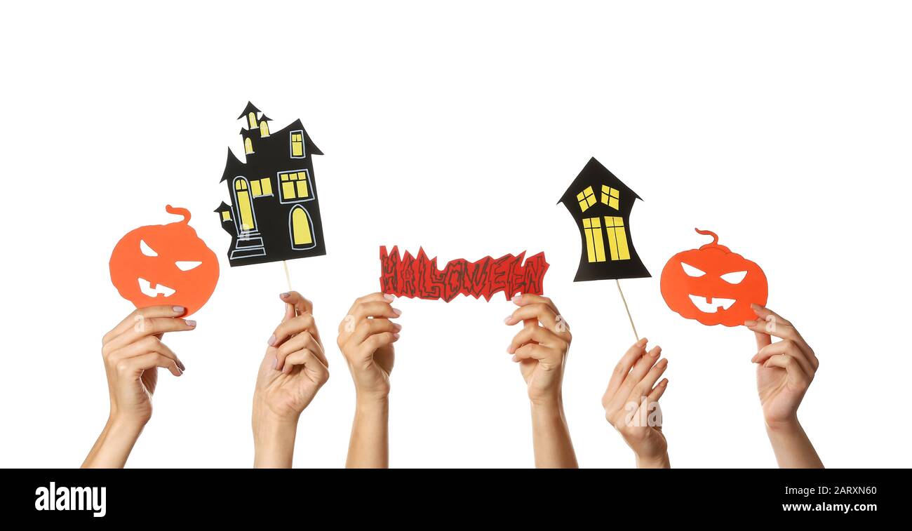 Many hands with Halloween decor on white background Stock Photo