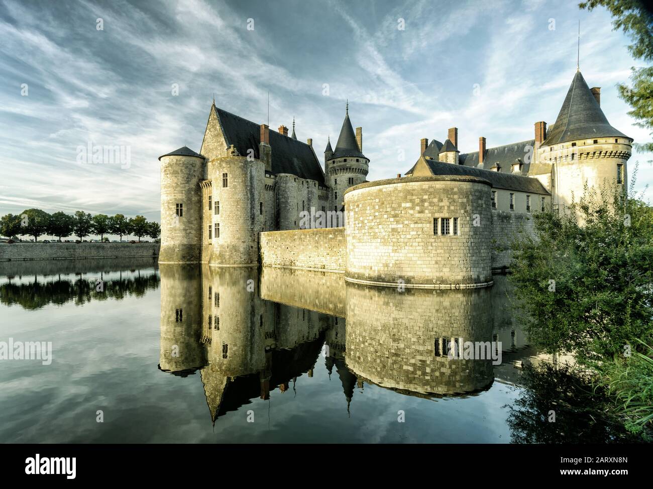 The chateau of Sully-sur-Loire in the evening, France. This castle is located in the Loire Valley, dates from the 14th century and is a prime example Stock Photo