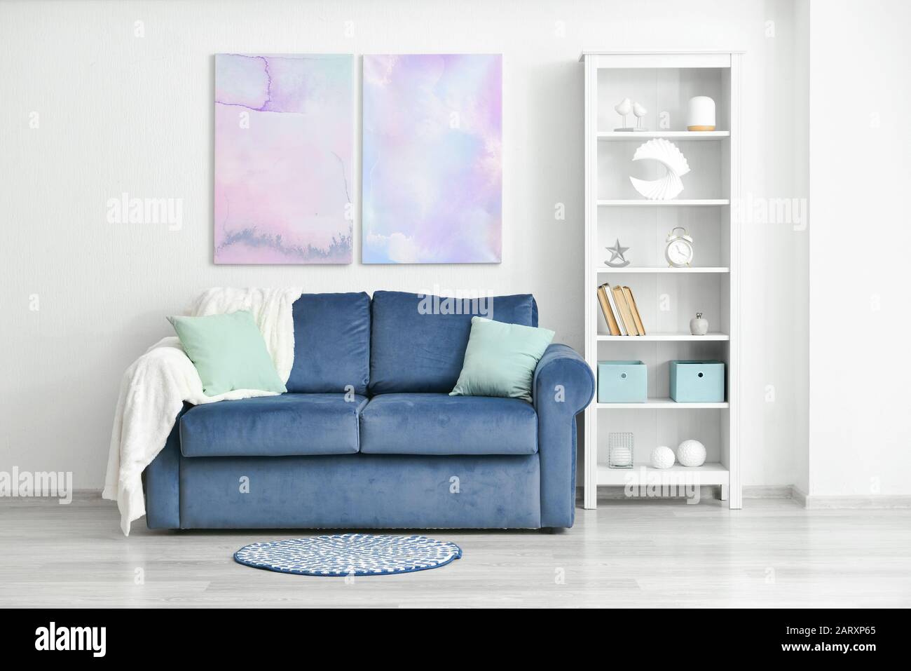 Stylish interior of living room with big sofa Stock Photo - Alamy