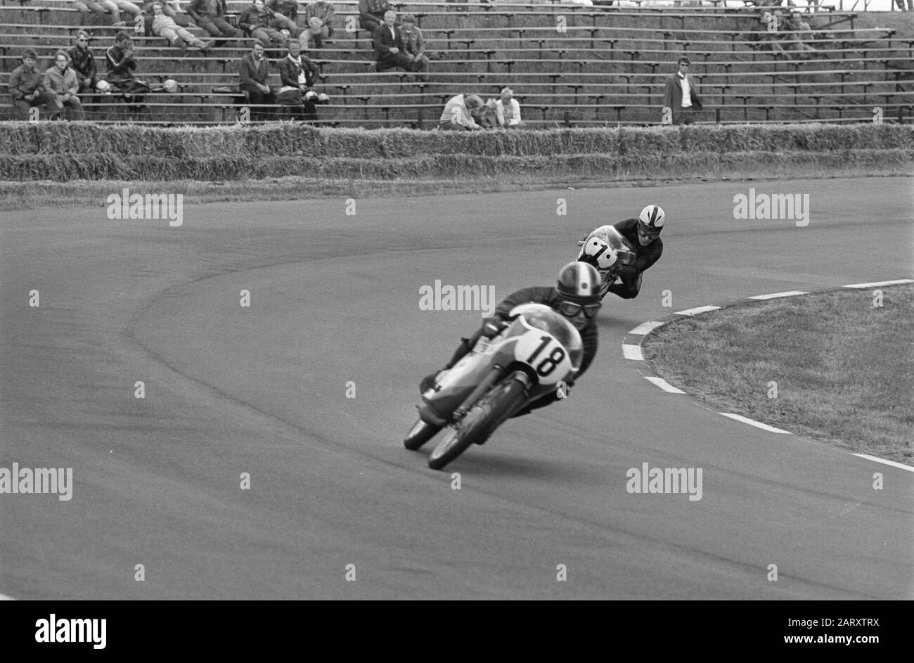 TT Assen 1970  TT-races in Assen; training Jan de Vries (nr. 18) with Angel Nieto (nr. 1) in the 50 cc Date: 25 June 1970 Location: Assen Keywords: motorsport Personal name: Nieto, Angel, Vries, Jan de ( motorcycle driver) Setting name: TT Stock Photo