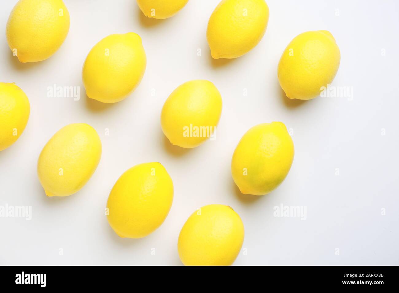 Ripe lemons on white background Stock Photo - Alamy