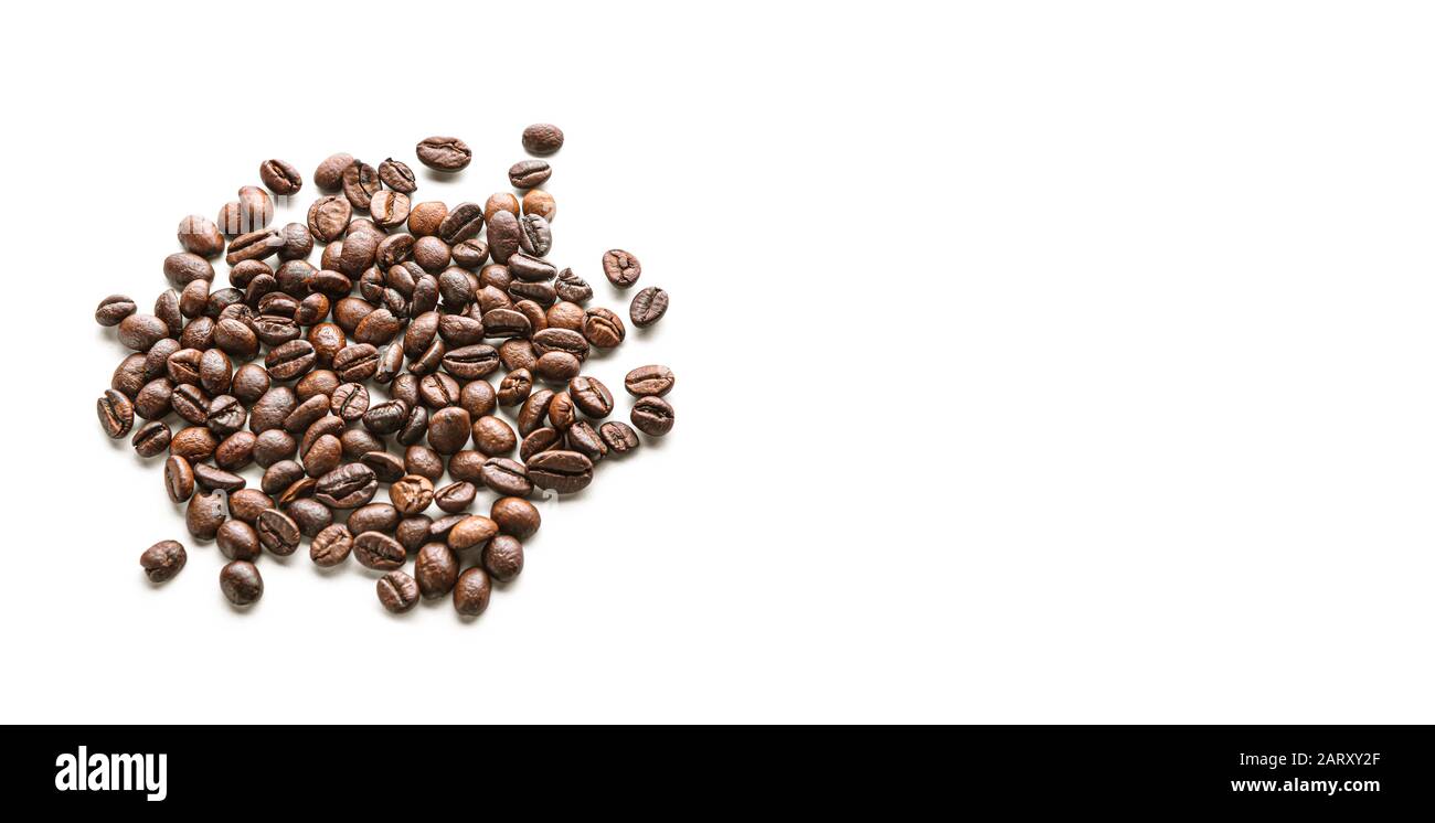 Heap of coffee beans on white background Stock Photo - Alamy