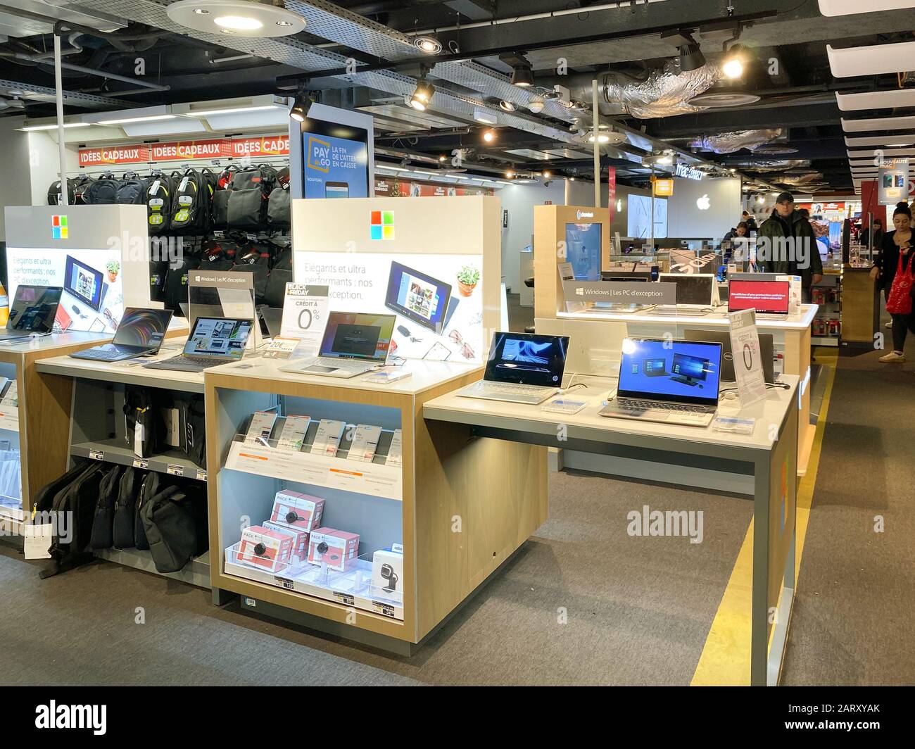 Nice, France - Nov 24, 2019: Multiple Microsoft Surface tablets and notebooks for sale at dedicated Microsoft stand inside FNAC French electronic store mall before Black Friday deals Stock Photo