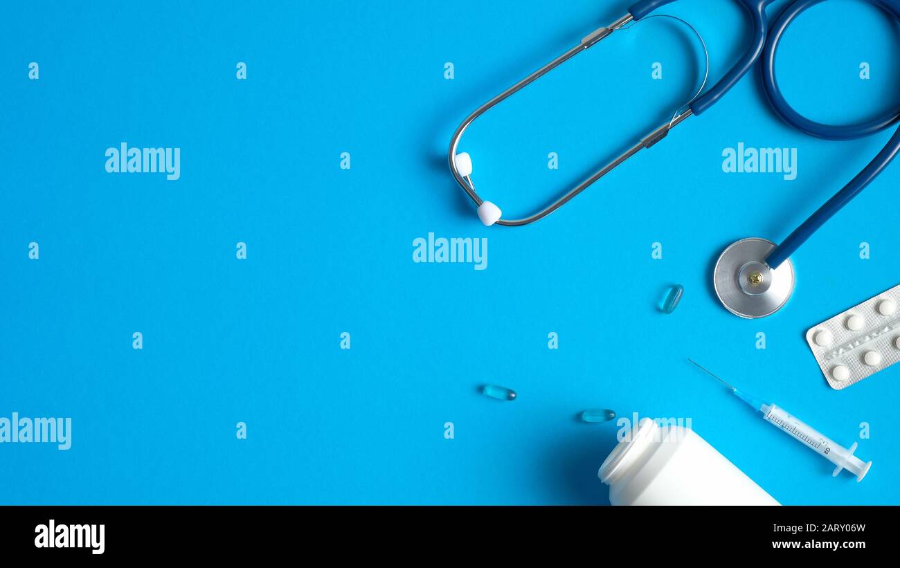 Medical equipment, tools, supplies on blue background. Flat lay