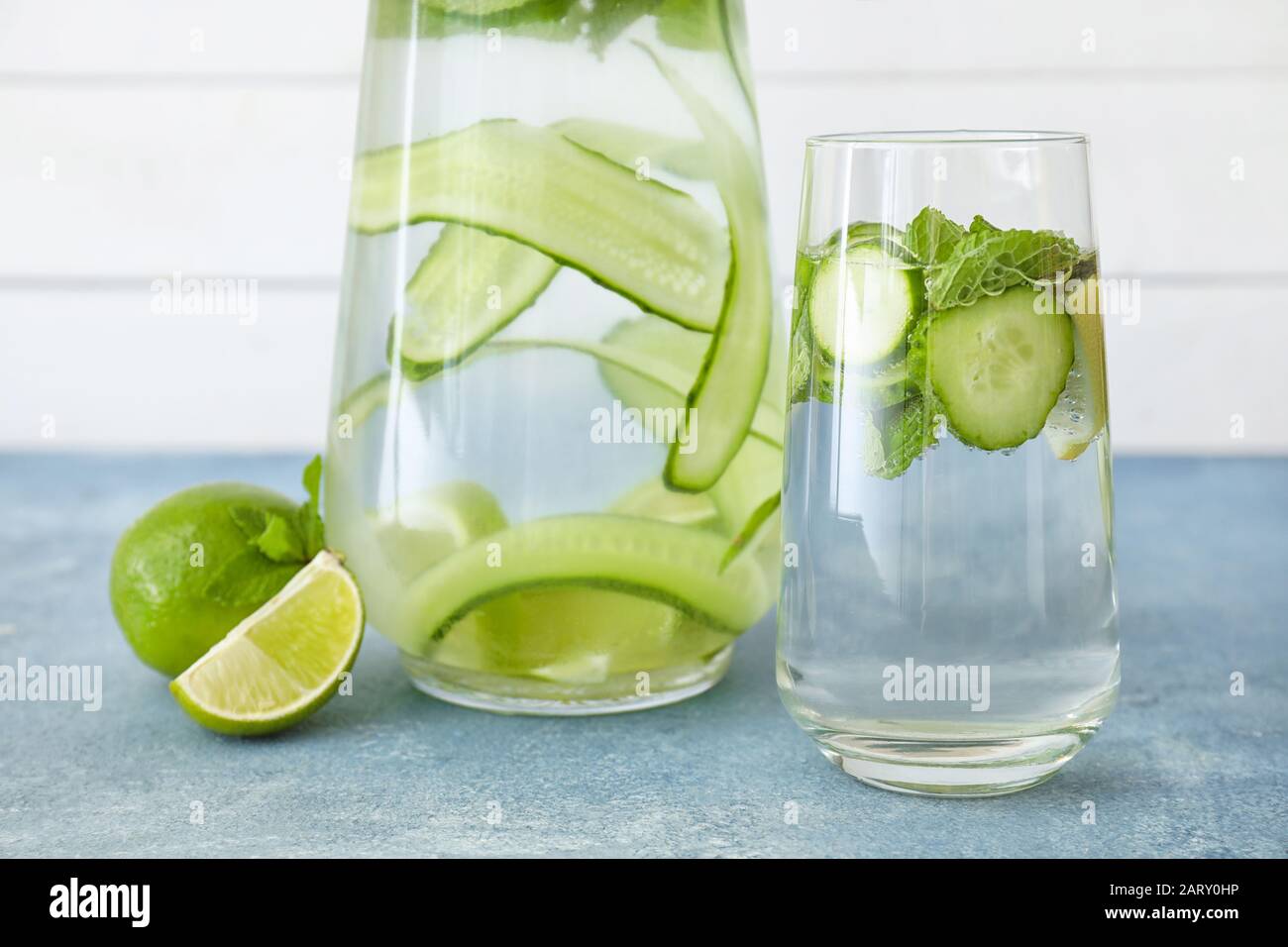 Glass and jug of cold cucumber water on table Stock Photo Alamy