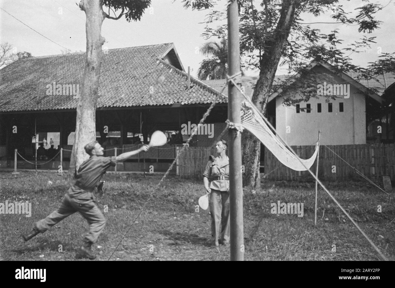 Sunday mood in Tjianjjoer  [two soldiers play a kind of badminton with bats] Date: July 13, 1947 Location: Cianjur, Indonesia, Dutch East Indies Stock Photo