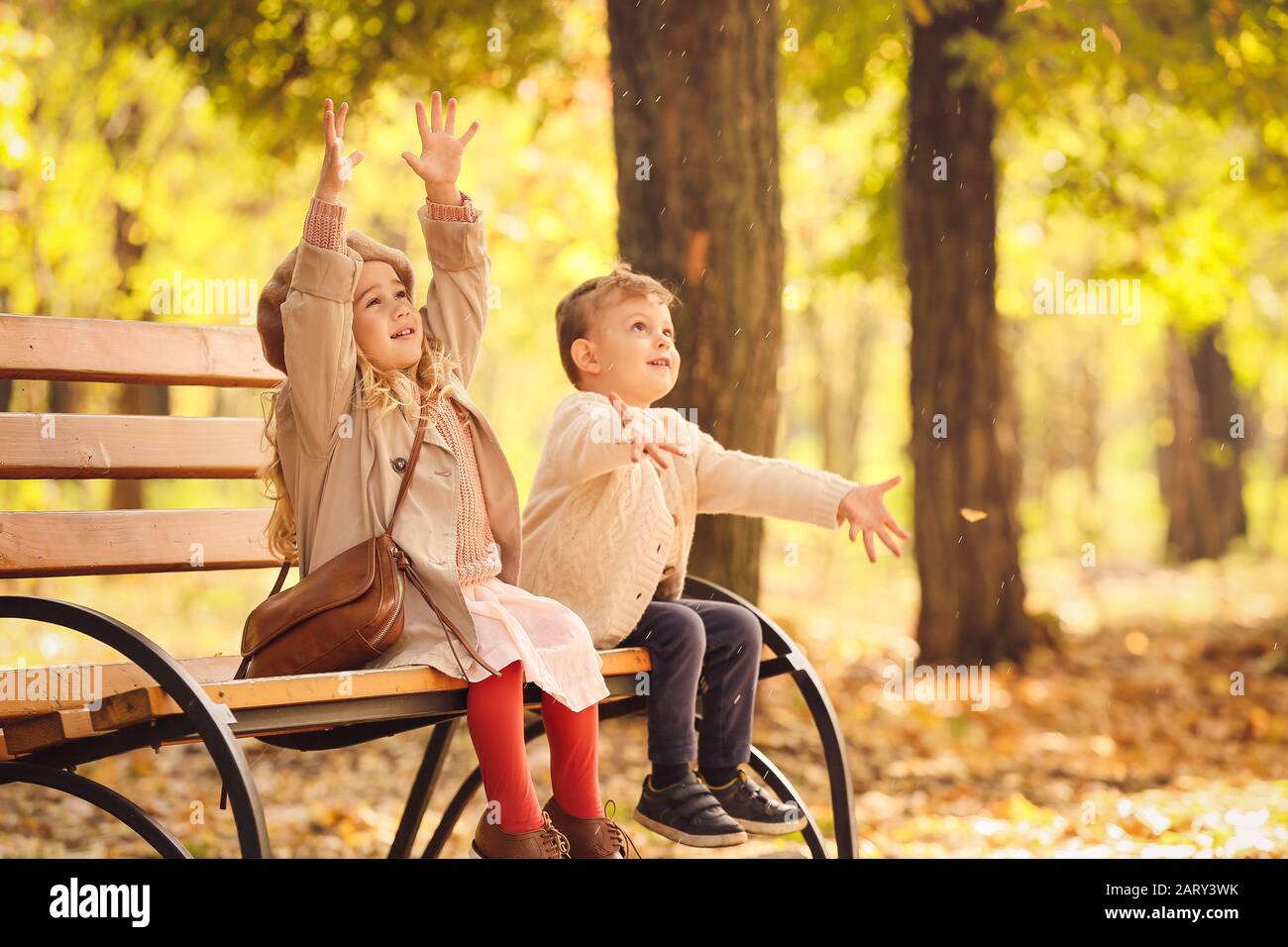 Cute little children having fun in autumn park Stock Photo