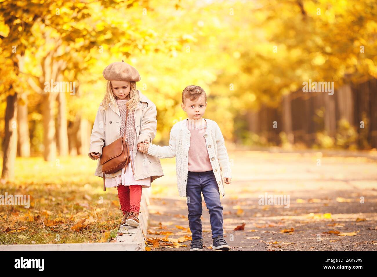 Cute little children walking in autumn park Stock Photo