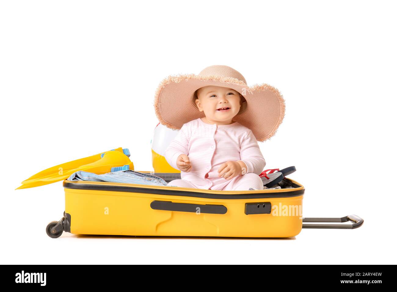 Cute baby with suitcase and belongings on white background Stock Photo