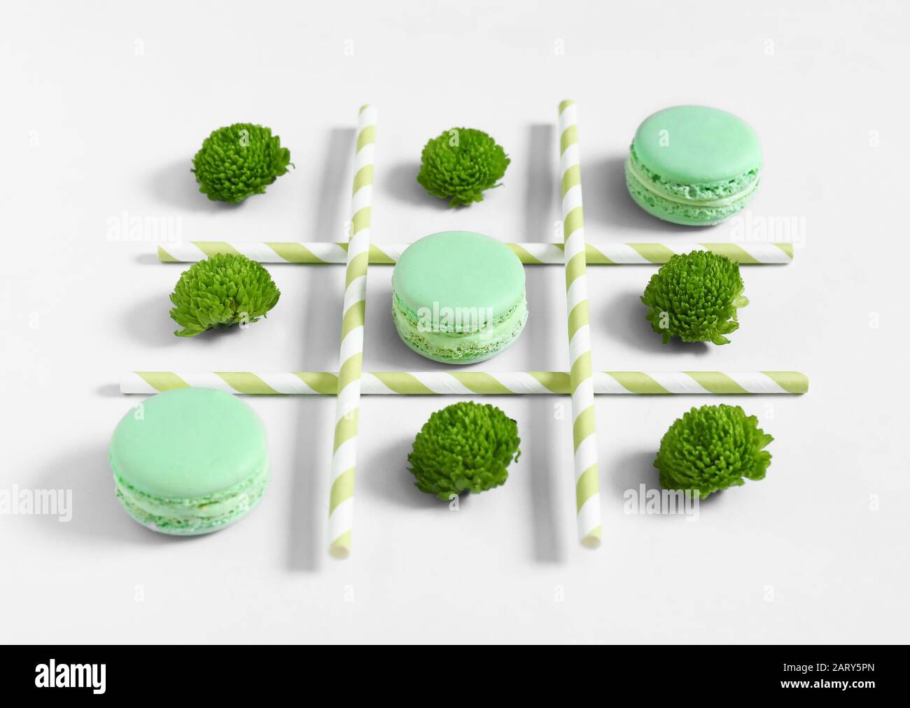 Creative composition with macarons on white background Stock Photo