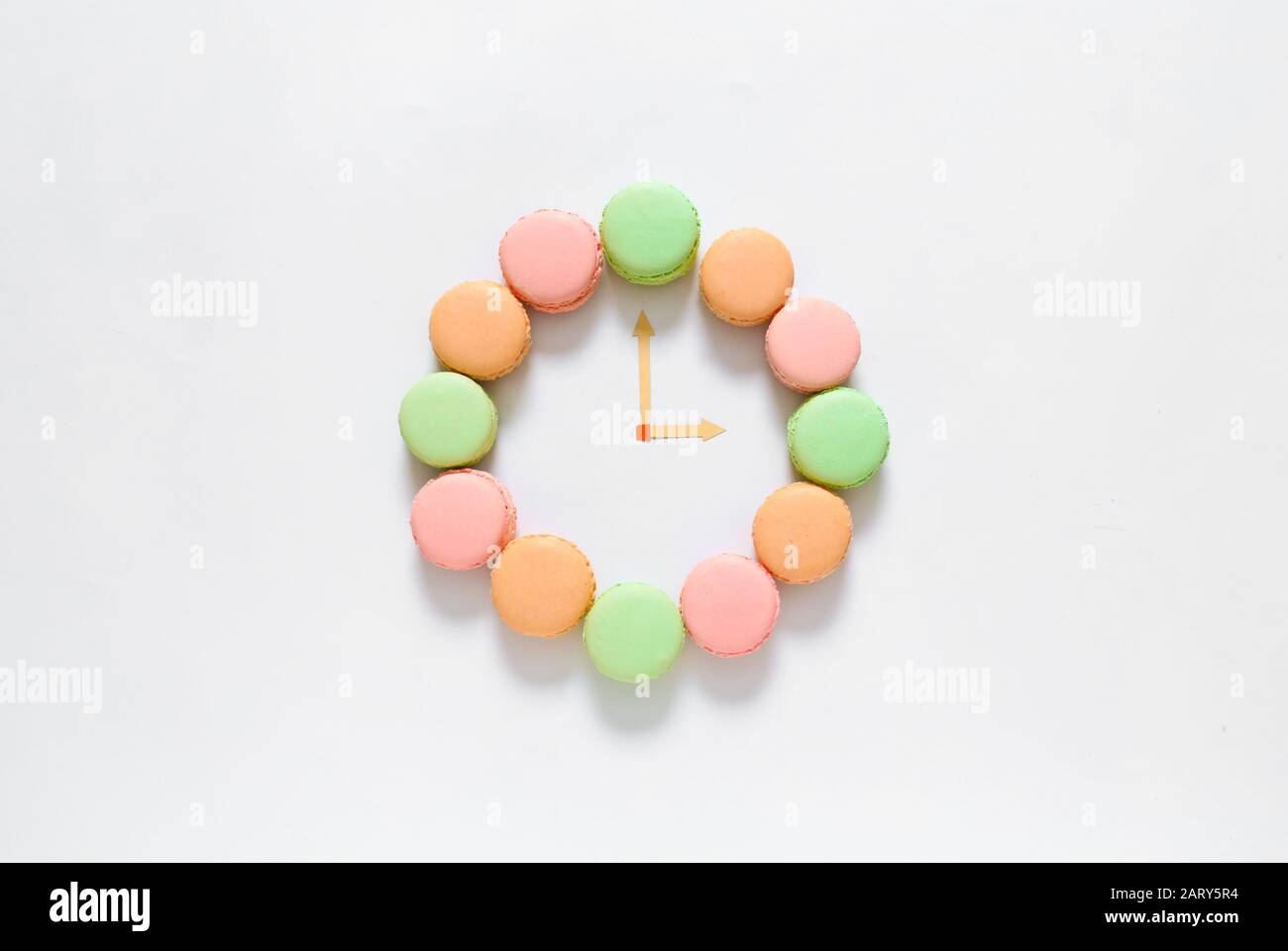 Creative composition with macarons on white background Stock Photo