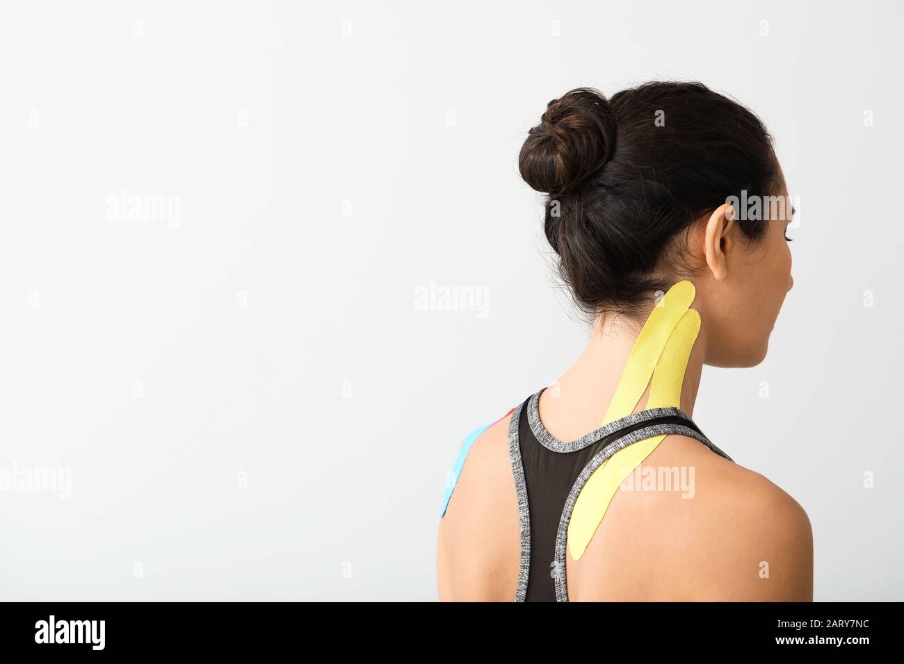 Woman taping neck hi-res stock photography and images - Alamy