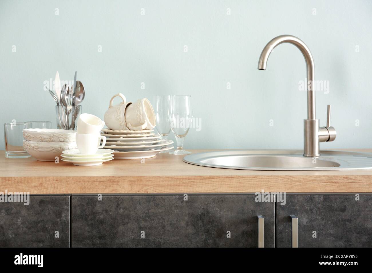 Set of clean dishware near kitchen sink Stock Photo Alamy