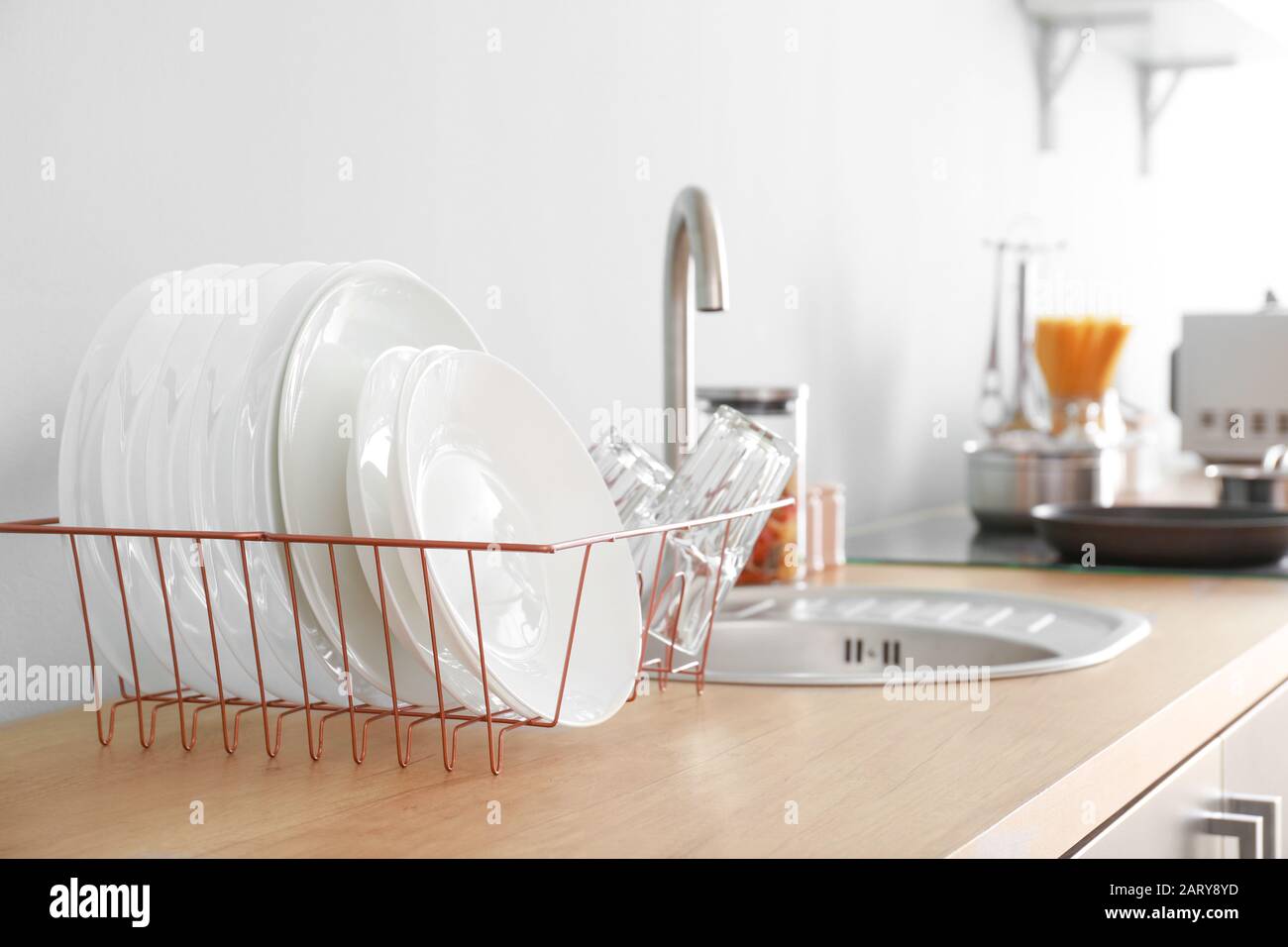 Set of clean dishware near kitchen sink Stock Photo Alamy
