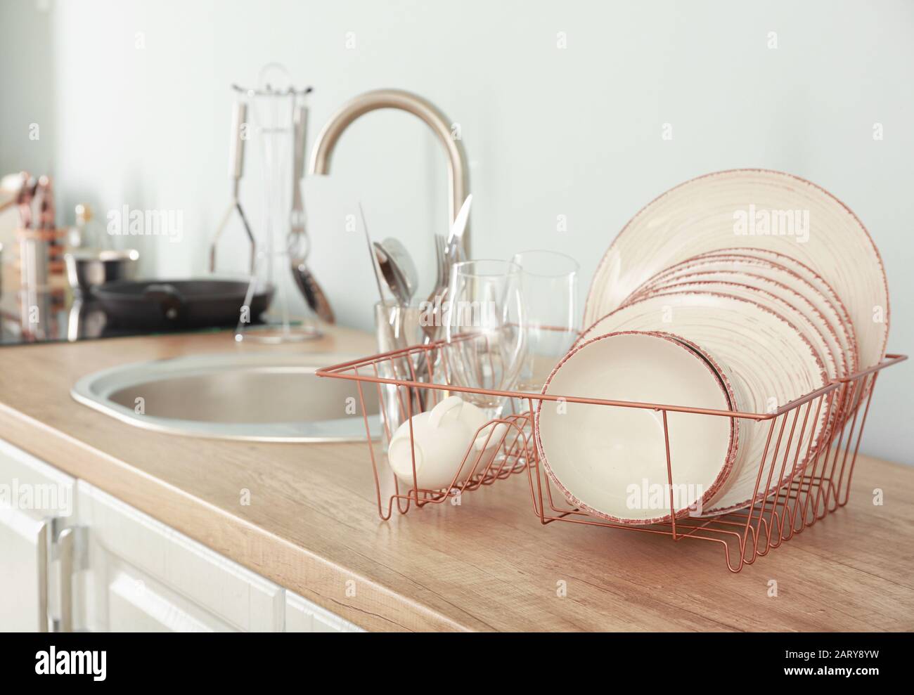 Set of clean dishware near kitchen sink Stock Photo Alamy