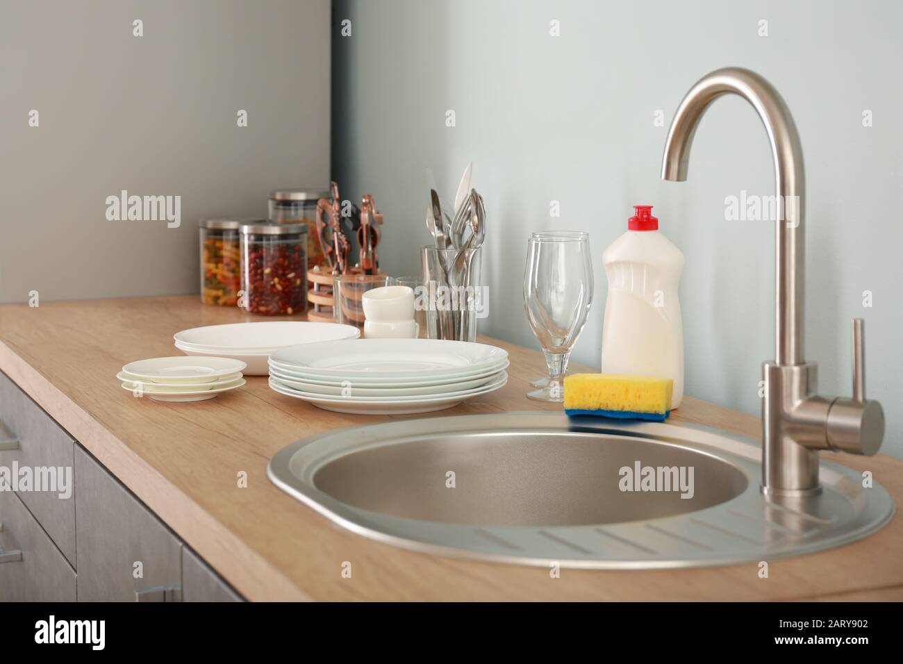 Set of clean dishware near kitchen sink Stock Photo Alamy