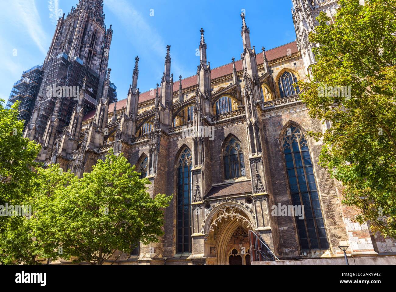 Ulm Minster or Cathedral of Ulm city, Germany. It is a famous landmark of Ulm. Ornate facade of Gothic church in summer. Scenery of medieval European Stock Photo