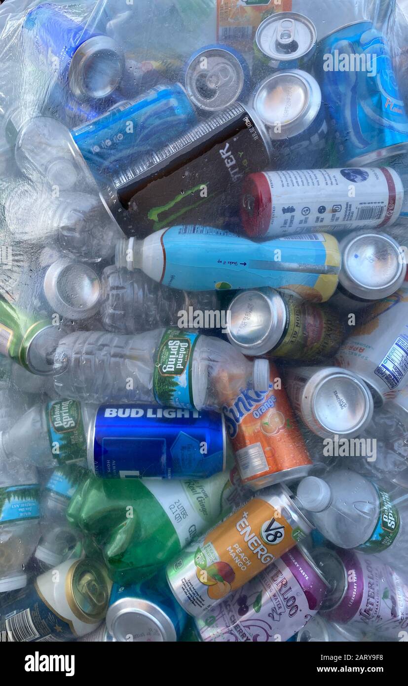 Aluminum and plastic cans and bottles packed in clear plastic bags for