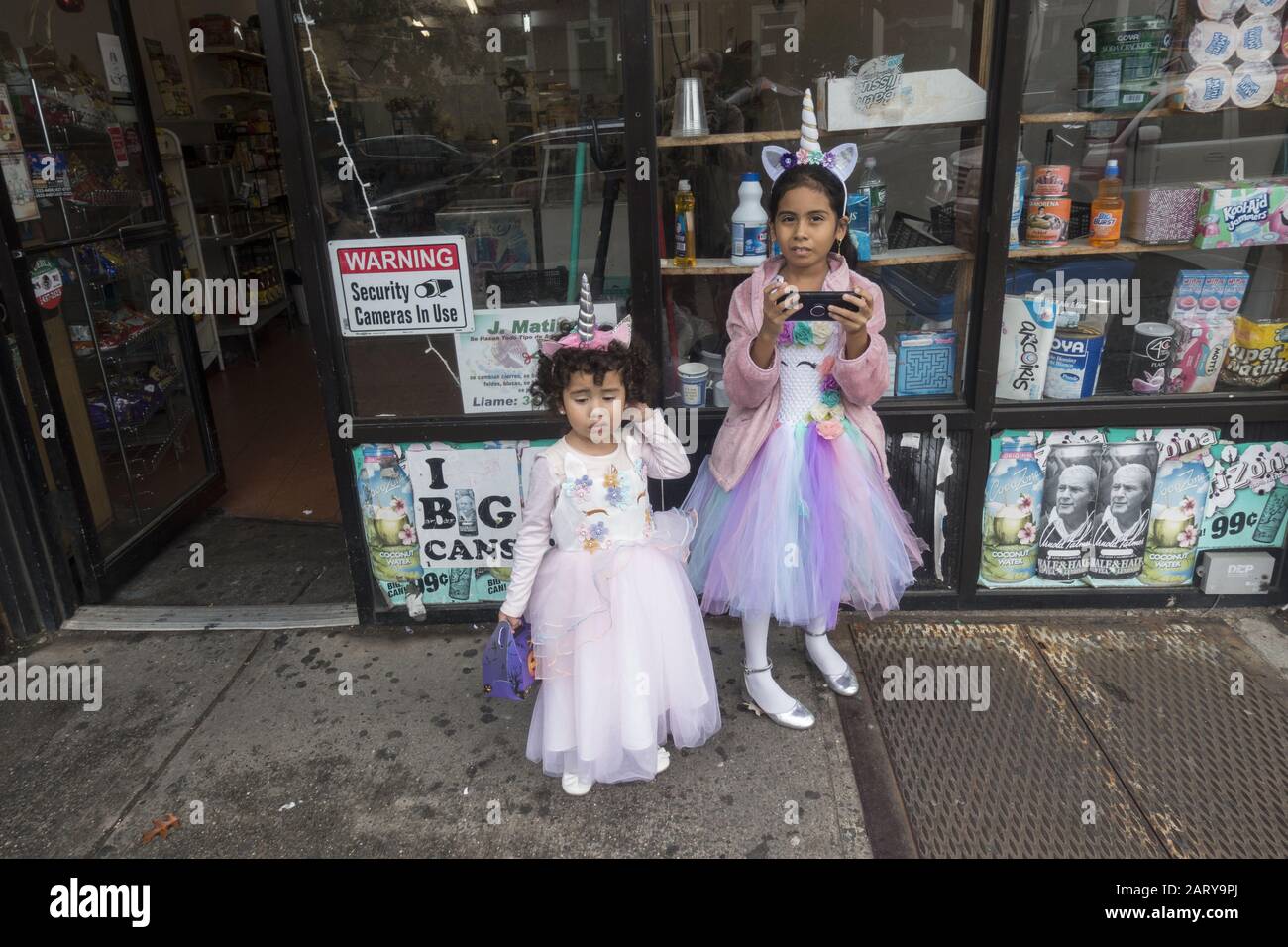 Sisters on the street in Halloween costumes along Fort Hamilton Parkway