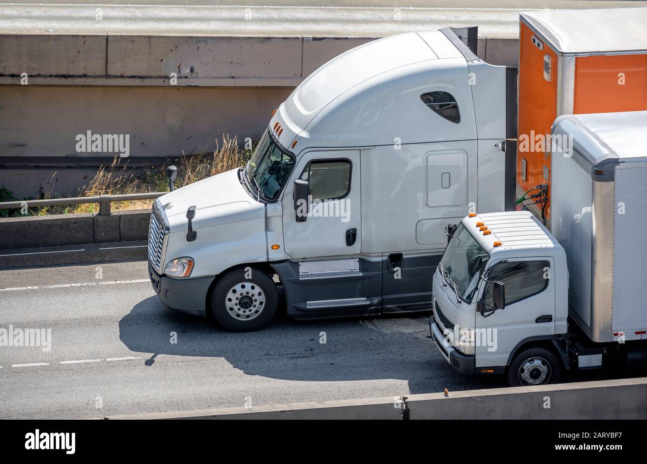 Different sizes and capacity big and small rigs semi trucks with semi