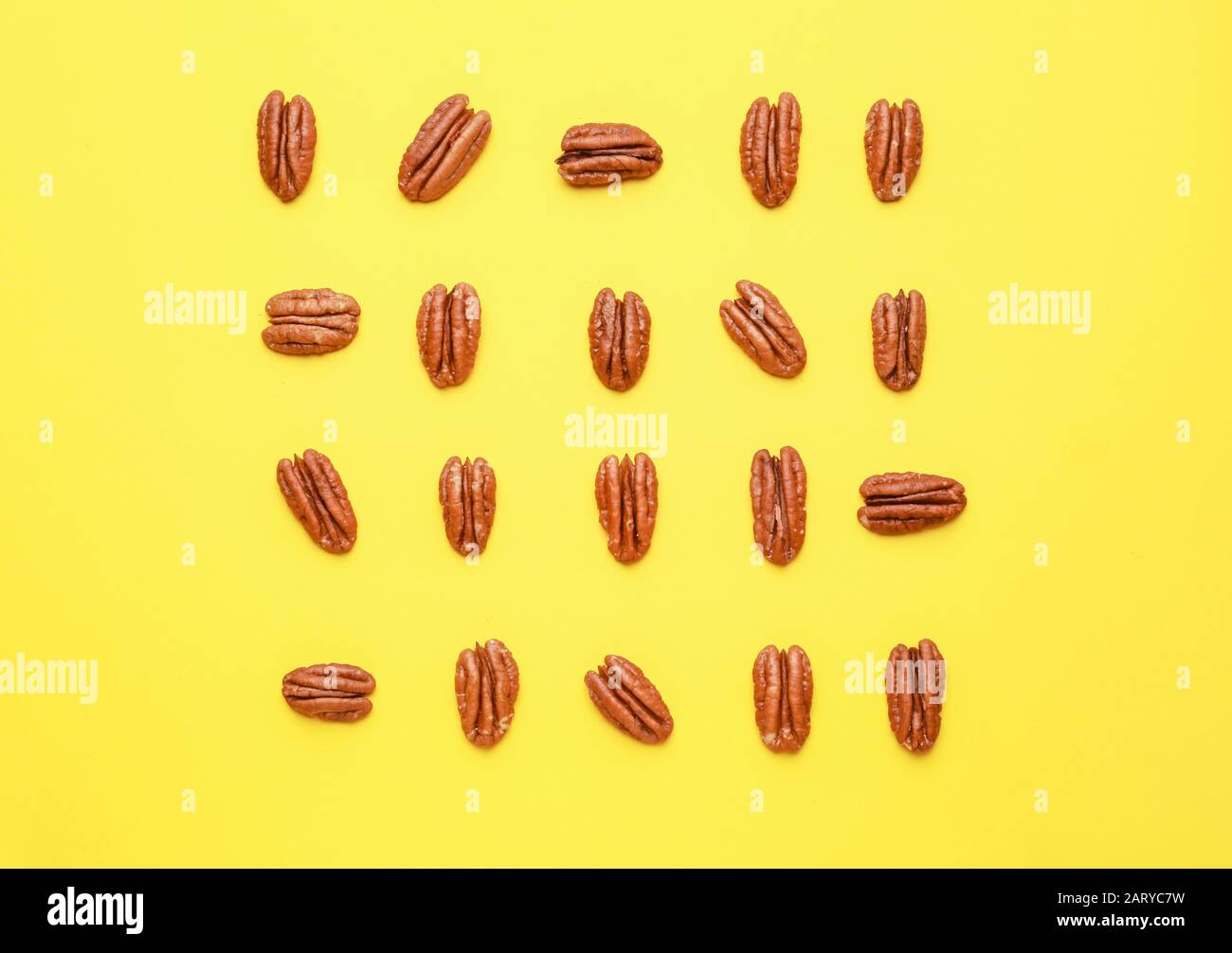 Tasty pecan nuts on color background Stock Photo