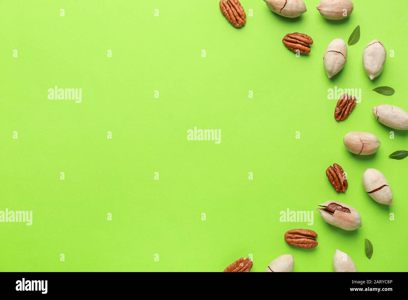 Tasty pecan nuts on color background Stock Photo