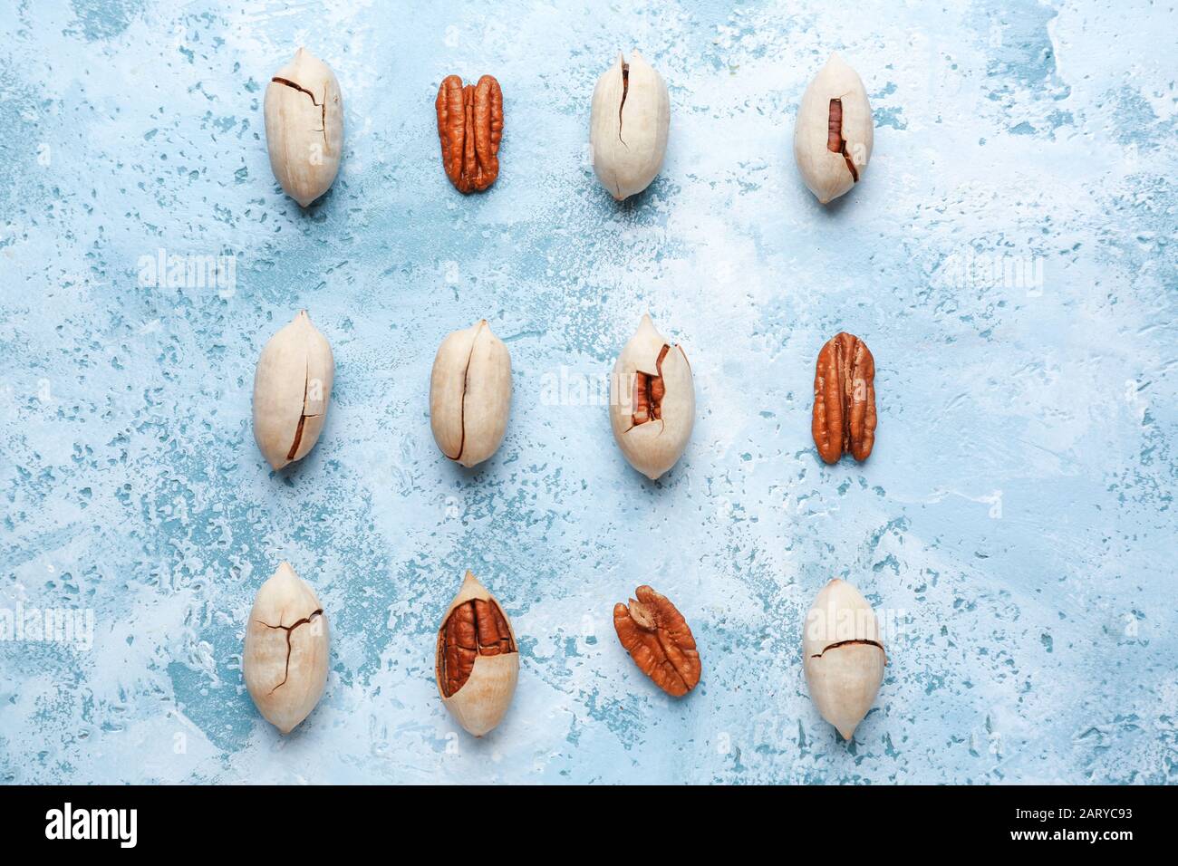 Tasty pecan nuts on color background Stock Photo