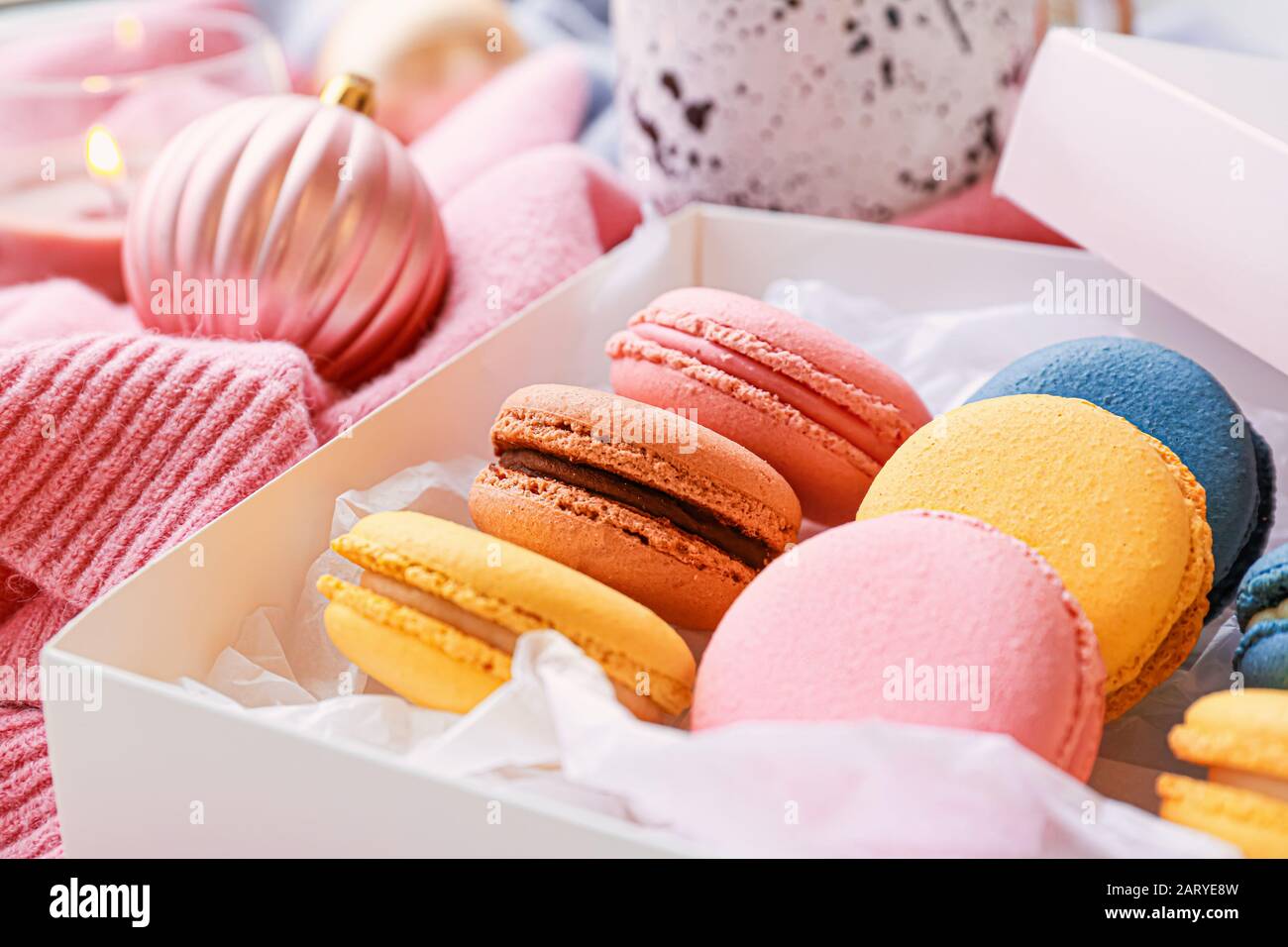 Different tasty macarons on table, closeup Stock Photo