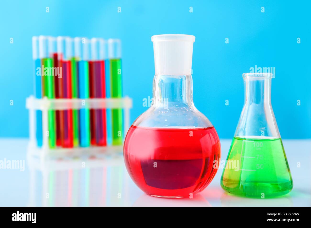 Test tubes and flasks with colorful samples in laboratory Stock Photo ...