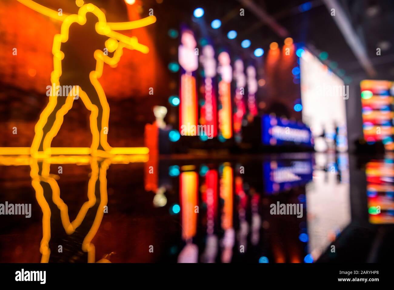 Blurred background of an esports event - Main stage venue, big screen and lights before the start of the tournament. Stock Photo