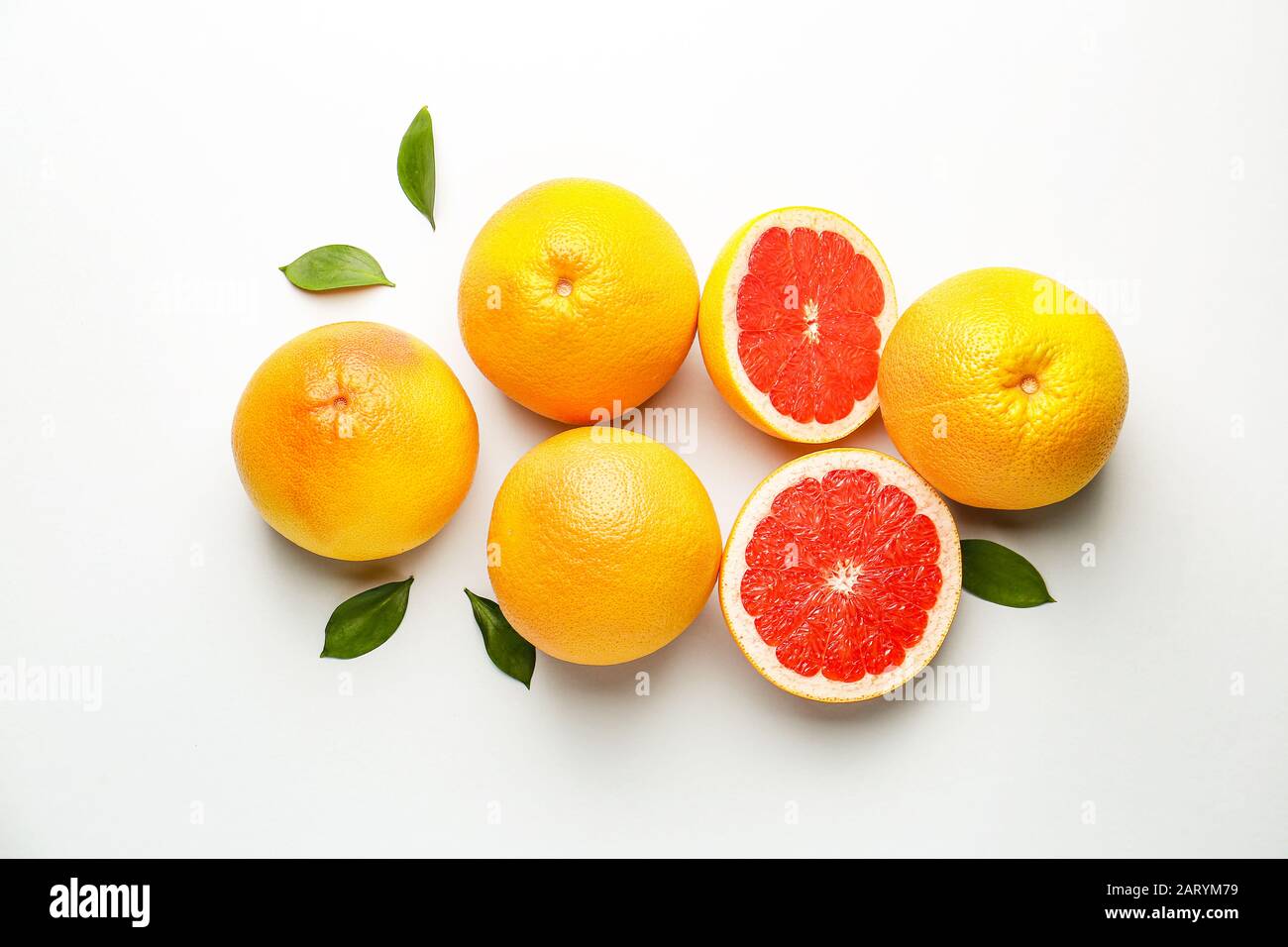 Fresh ripe grapefruits on light background Stock Photo