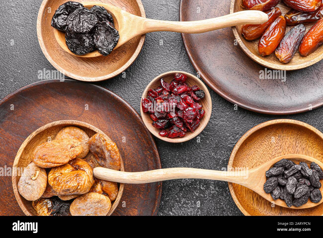 Different dried fruits on dark background Stock Photo
