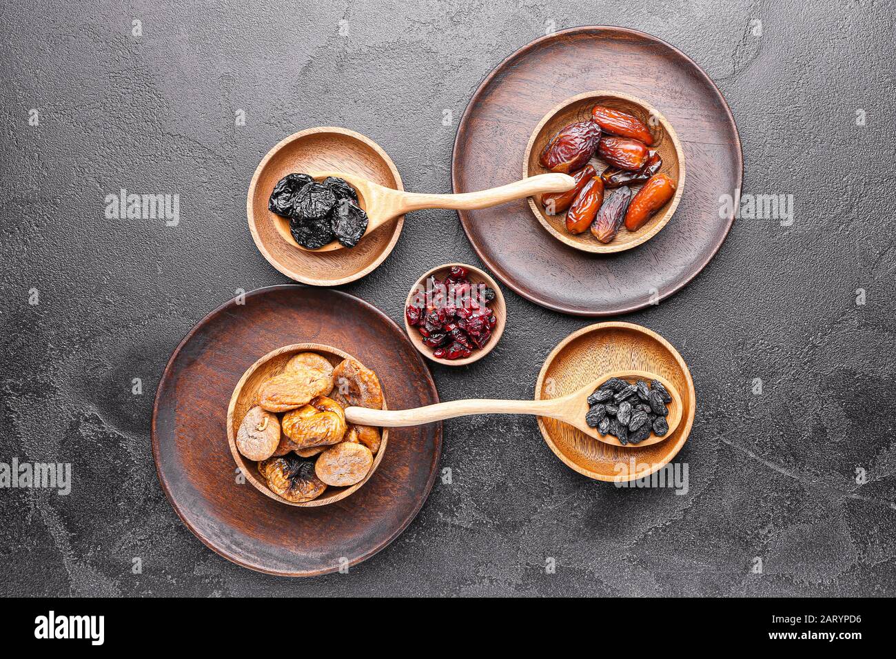Different dried fruits on dark background Stock Photo