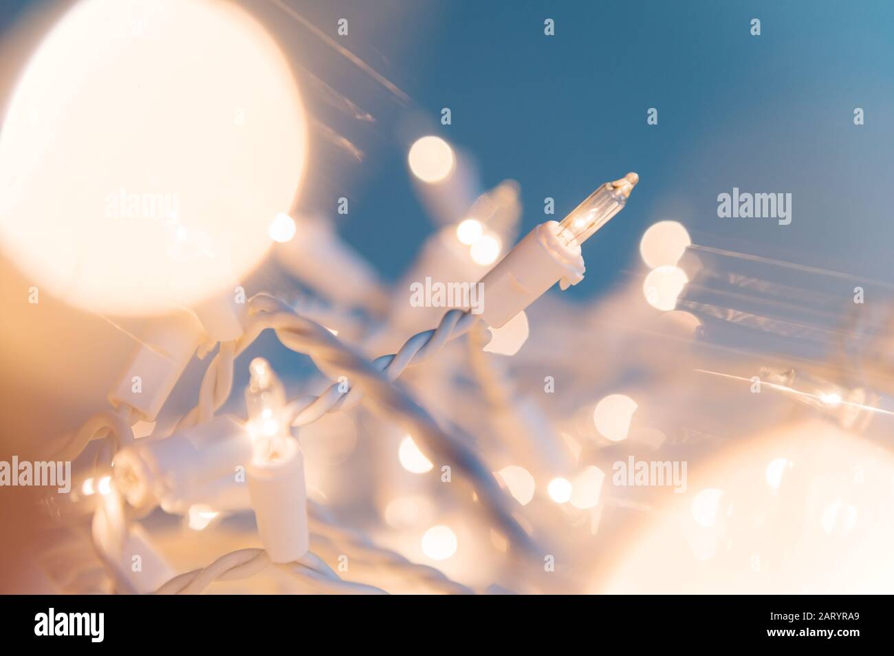 Illuminated fairy lights in soft focus Stock Photo