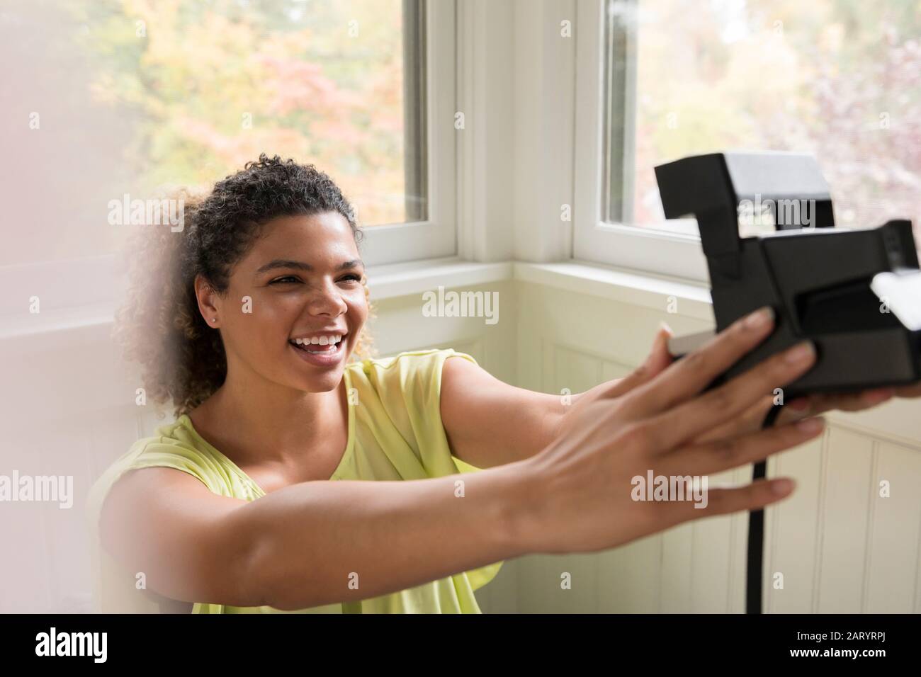 Woman taking polaroid hi-res stock photography and images - Alamy